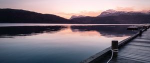 Preview wallpaper pier, mountains, lake, rope, sunset