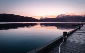 Preview wallpaper pier, mountains, lake, rope, sunset
