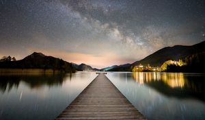 Preview wallpaper pier, mountains, lake, stars, night, dark