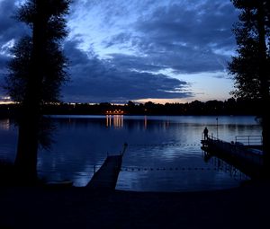 Preview wallpaper pier, night, river, silhouette, solitude