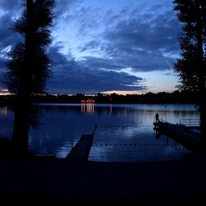 Preview wallpaper pier, night, river, silhouette, solitude