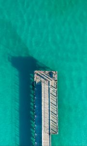 Preview wallpaper pier, ocean, shadow, top view, surface, turquoise