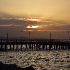 Preview wallpaper pier, ocean, sunset, dark