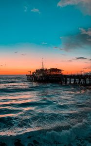 Preview wallpaper pier, ocean, surf, sunset, wave