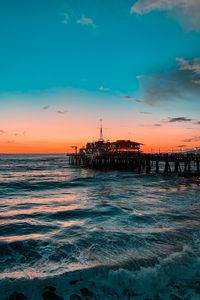 Preview wallpaper pier, ocean, surf, sunset, wave