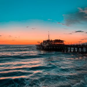 Preview wallpaper pier, ocean, surf, sunset, wave