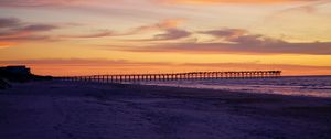 Preview wallpaper pier, pilings, sea, sunset, silhouette