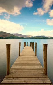 Preview wallpaper pier, river, mountain, distance, sky