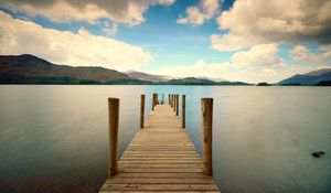 Preview wallpaper pier, river, mountain, distance, sky