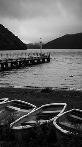 Preview wallpaper pier, river, mountains, boats, black and white