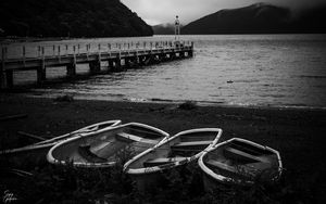 Preview wallpaper pier, river, mountains, boats, black and white