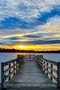 Preview wallpaper pier, river, sunset, sun