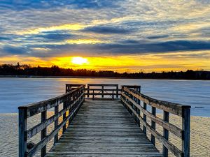 Preview wallpaper pier, river, sunset, sun