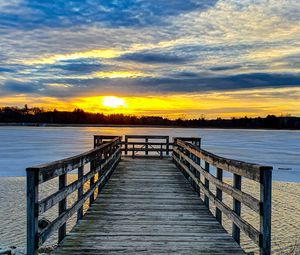 Preview wallpaper pier, river, sunset, sun