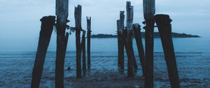 Preview wallpaper pier, ruins, sea, coast, night, twilight