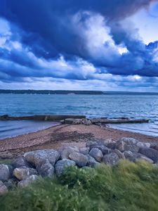 Preview wallpaper pier, sea, clouds, sky, stones