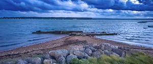 Preview wallpaper pier, sea, clouds, sky, stones