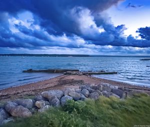 Preview wallpaper pier, sea, clouds, sky, stones