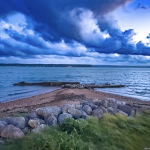 Preview wallpaper pier, sea, clouds, sky, stones