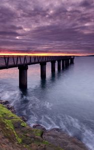 Preview wallpaper pier, sea, evening, clouds, stones, moss