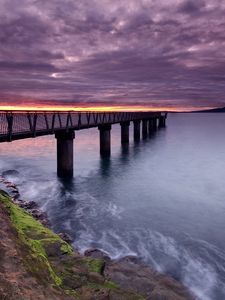 Preview wallpaper pier, sea, evening, clouds, stones, moss