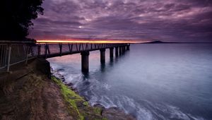 Preview wallpaper pier, sea, evening, clouds, stones, moss