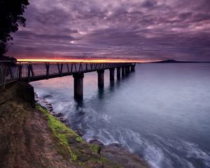 Preview wallpaper pier, sea, evening, clouds, stones, moss