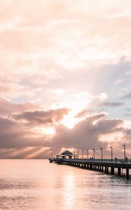 Preview wallpaper pier, sea, horizon, clouds, silhouettes