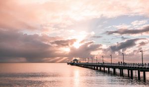 Preview wallpaper pier, sea, horizon, clouds, silhouettes