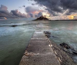 Preview wallpaper pier, sea, island, clouds, landscape