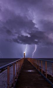 Preview wallpaper pier, sea, lighthouse, lightning, thunderstorm, dark
