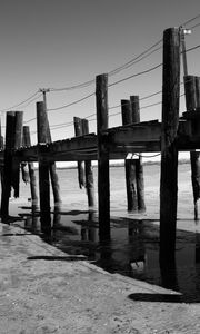 Preview wallpaper pier, sea, pilings, bw