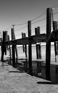 Preview wallpaper pier, sea, pilings, bw