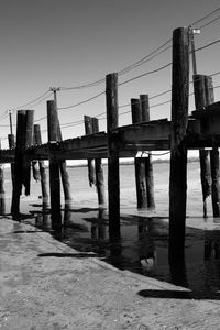 Preview wallpaper pier, sea, pilings, bw