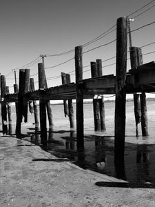 Preview wallpaper pier, sea, pilings, bw