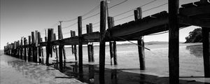 Preview wallpaper pier, sea, pilings, bw