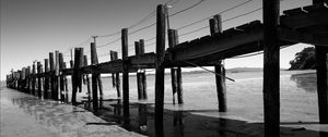 Preview wallpaper pier, sea, pilings, bw