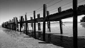 Preview wallpaper pier, sea, pilings, bw