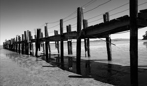 Preview wallpaper pier, sea, pilings, bw