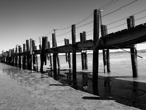 Preview wallpaper pier, sea, pilings, bw