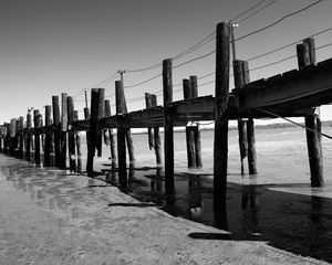 Preview wallpaper pier, sea, pilings, bw