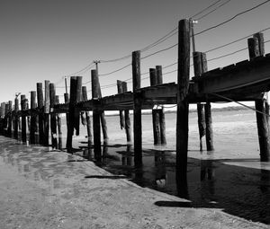 Preview wallpaper pier, sea, pilings, bw