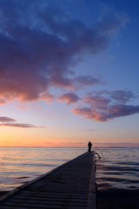 Preview wallpaper pier, sea, silhouette, loneliness, horizon, distance