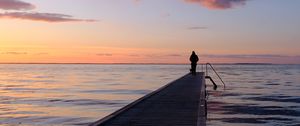 Preview wallpaper pier, sea, silhouette, loneliness, horizon, distance