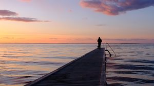 Preview wallpaper pier, sea, silhouette, loneliness, horizon, distance