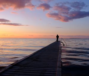 Preview wallpaper pier, sea, silhouette, loneliness, horizon, distance