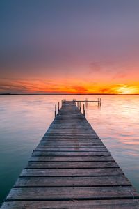 Preview wallpaper pier, sea, sunset, horizon, sky, water