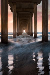 Preview wallpaper pier, sea, waves, pillars, water