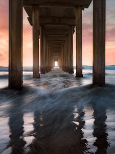 Preview wallpaper pier, sea, waves, pillars, water