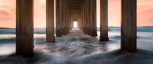 Preview wallpaper pier, sea, waves, pillars, water